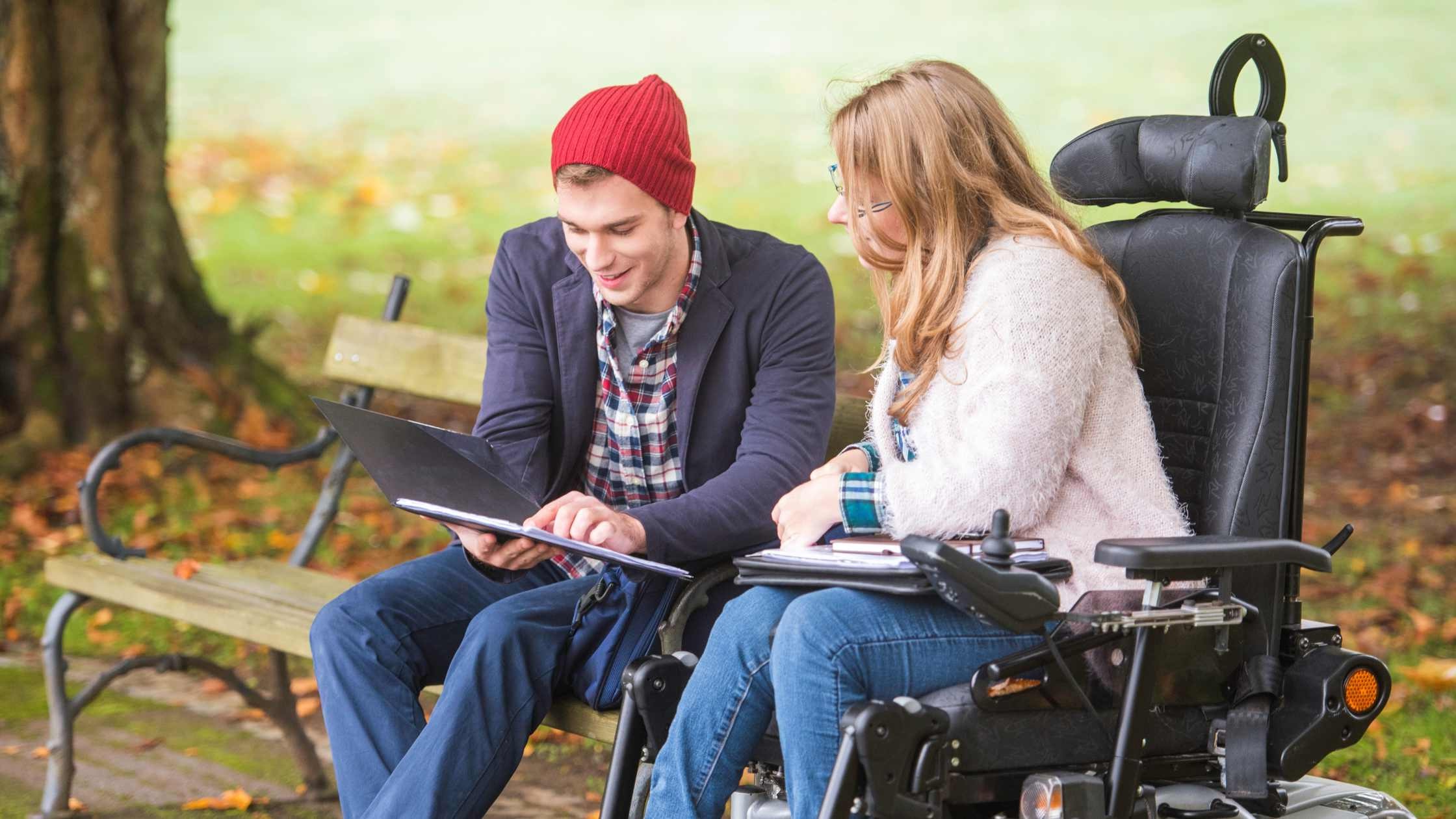 Support coordinator helping a participant outdoors